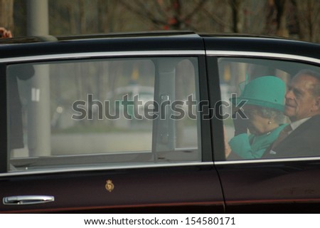 BERLIN-NOVEMBER 2, 2004: Queen Elizabeth II (Elizabeth Alexandra Mary Windsor), Prince Philip in her car during a state visit in Germany.