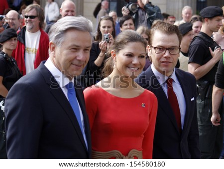 BERLIN-MAY 27, 2011 :Klaus Wowereit, Crown Princess Victoria of Sweden with Prince Daniel of Sweden during an official visit at the Pariser Platz in Berlin.