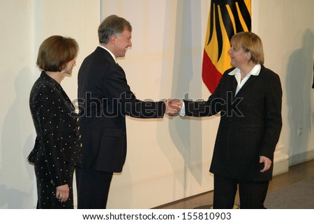 JANUARY 11, 2005 - BERLIN: German President Horst Koehler with his wife welcome Angela Merkel a the official new years reception in the Schloss Charlottenburg in Berlin.