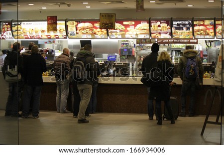 NOVEMBER 2013 - BERLIN: people standing in a queue in a store of the fast food chain \
