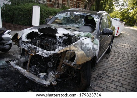 JUNE 10, 2011 - BERLIN: a burned out Porsche Cayenne luxury car - vandalist acts like this have become a common sight in Berlin these days.