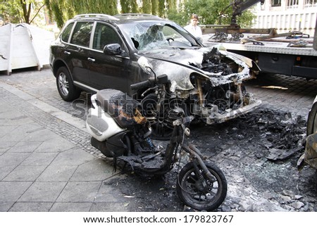 JUNE 10, 2011 - BERLIN: a burned out Porsche Cayenne luxury car - vandalist acts like this have become a common sight in Berlin these days.