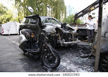 JUNE 10, 2011 - BERLIN: a burned out Porsche Cayenne luxury car - vandalism acts like this have become a common sight in Berlin these days.