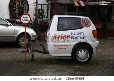 CIRCA FEBRUARY 2009 - BERLIN: the half of a small car (VW Polo) as an advertisement for a car garage, Berlin.