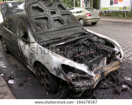 CIRCA AUGUST 2013 - BERLIN: a burned out car in the Wedding district of Berlin - vandalism acts like this have become a common sight in Berlin these days.