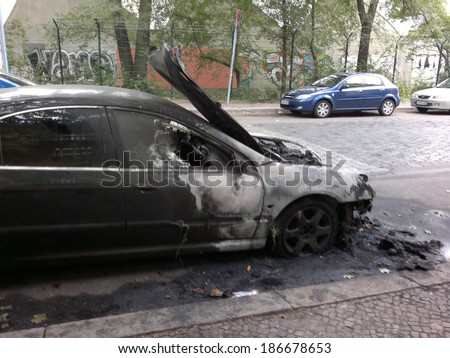 CIRCA AUGUST 2013 - BERLIN: a burned out car in the Wedding district of Berlin - vandalism acts like this have become a common sight in Berlin these days.