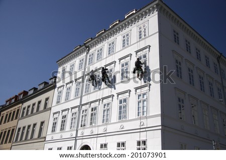 CIRCA APRIL 2009 - BERLIN: cat burglars at a house fassade for maintenance work in the Mitte district of Berlin.