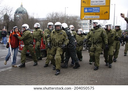 MARCH 28, 2009 - BERLIN: riot police forces arrest a protester - protests against the banking crisis in Europe in Berlin.