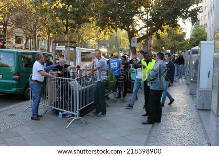 SEPTEMBER 18, 2014 - BERLIN: fans of Apple products waiting in line for the new IPhone6 one day before the sale of the new telephone starts, Apple Store, Berlin.