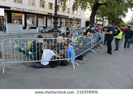 SEPTEMBER 18, 2014 - BERLIN: fans of Apple products waiting in line for the new IPhone6 one day before the sale of the new telephone starts, Apple Store, Berlin.