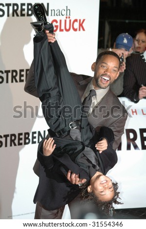BERLIN, JANUARY 9, 2007: Will Smith turns his son Jaden Christopher Syre Smith upside-down at the German premiere of the film \