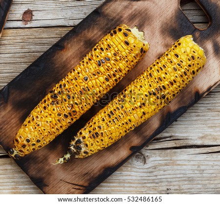 Grilled Corn closeup on a vintage kitchen board