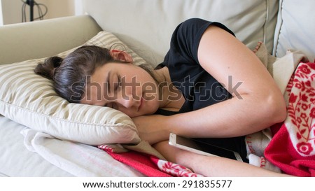 Sleeping beauty by her smart-phone