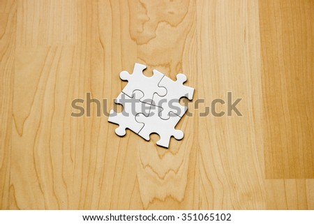 Four puzzle pieces put together (white)