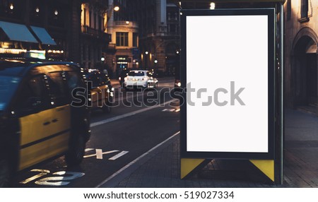 Blank advertising light box on the bus stop, mockup of empty ad billboard on bus station, template banner on background city street for message or text in Barcelona, afisha board