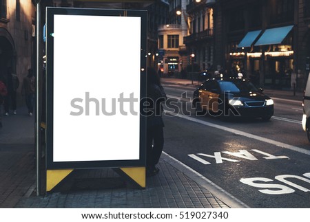 Blank advertising light box on the bus stop, mockup of empty ad billboard on bus station, template banner on background city street for message or text in Barcelona, afisha board