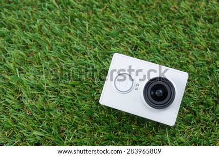 BANGKOK, THAILAND - JUNE 3, 2015:Photo of Xiaomi Yi Action Camera White Standard Set on Artificial Grass, lightweight action camera by Xiaomi (China)