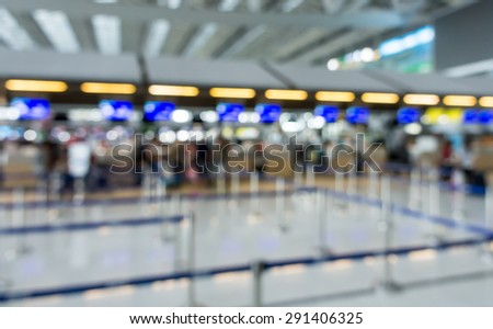 Abstract Blur Background : Airport Check-In Counters With Passengers And Crowd Control Barriers With Bokeh