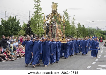 Holy Mary of Hanswijk statue carried by church community.Shot at a public event. Hanswijk cavalcade in Mechelen,2013.