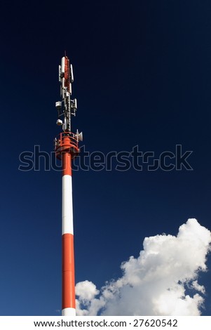 Cellular tower against blue sky and clouds #2