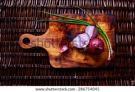 husk of red onion, red onion and green onion in creative picture of  vegetables