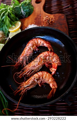 Young married couple has prepared a romantic light dinner of prawn