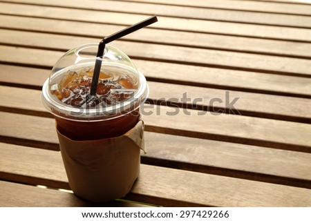 ice black coffee on wooden table