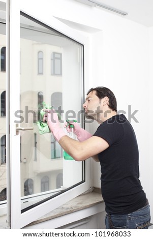 Man cleaning a window
