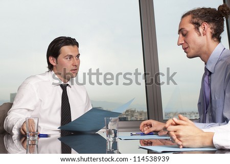 Consultation with male financial adviser in a nice office