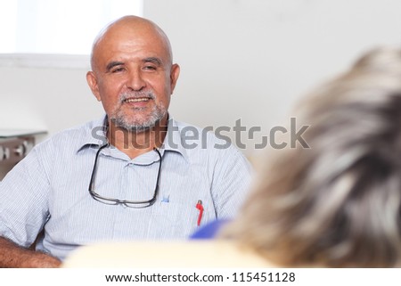 Two older persons talking