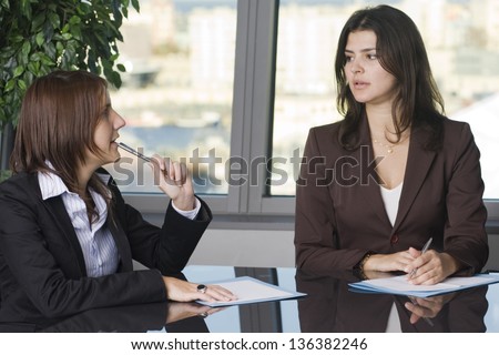 Client with lawyer discussing divorce in a nice office