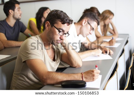 bored student writing an exam