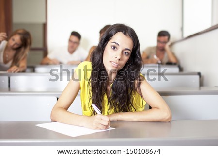 Latin student writing an exam