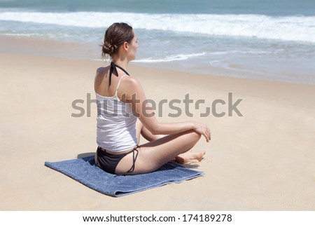 Yoga exercise sitting cross-legged