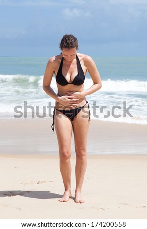 Woman with stomachache outside