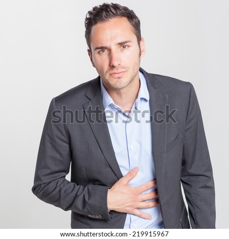 casual man with stomach problems