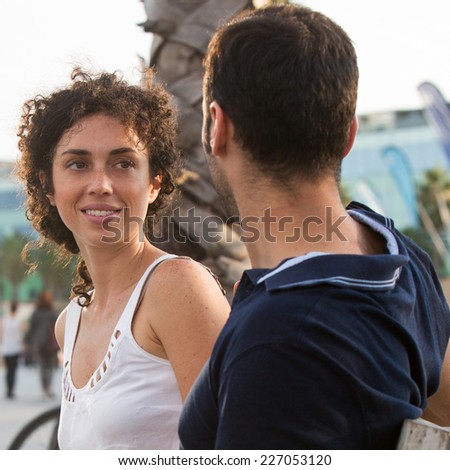 Two persons talking outside