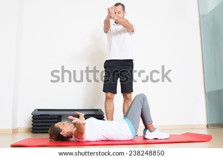 flexibility exercise with elder woman