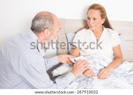 Giving medication to an elderly woman