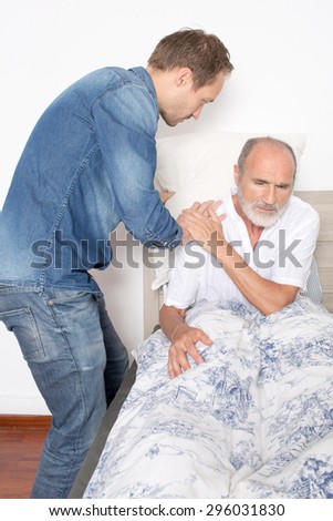 Helping man going out of bed