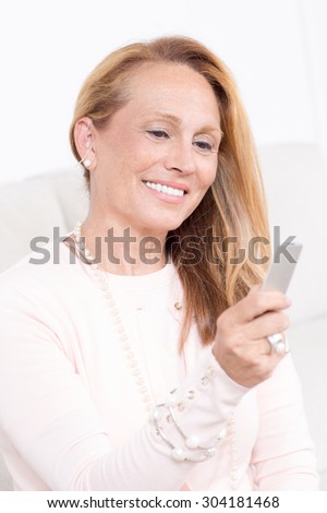 Elderly woman with a deaf-aid
