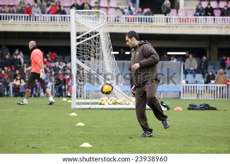 BARCELONA - JANUARY 7: The spanish soccer team FC Barcelona with the team coach Pep Guardiola and the goalkeeper Victor Valdes during a training January 7, 2009 in Barcelona, Spain.