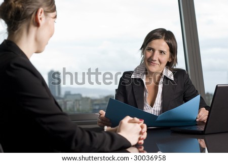 Young woman having a job interview in a beautiful office