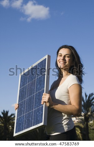 Young woman with  a solar panel