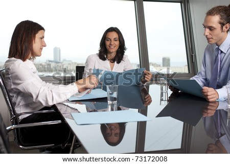 Business training in front of a panorama window