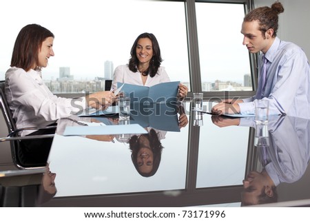 Business training in front of a panorama window