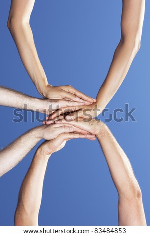 Three persons put their palms together