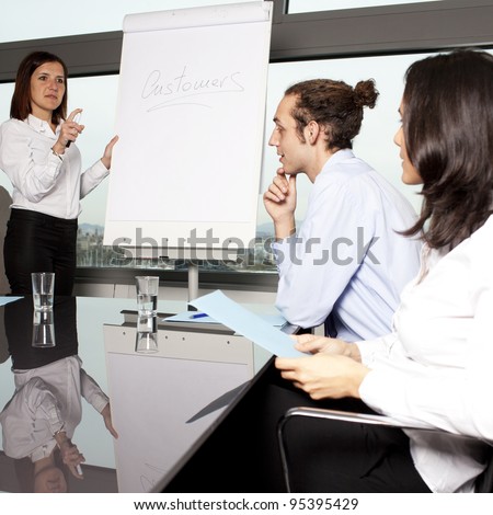 Group of office workers in a boardroom presentation