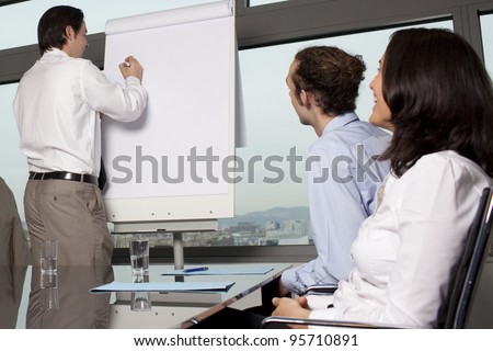 Group of office workers in a boardroom presentation
