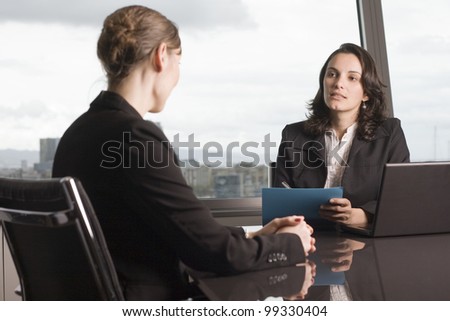 Insurance agent with client in a nice office